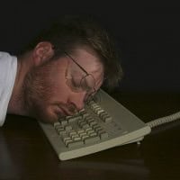 man asleep at keyboard