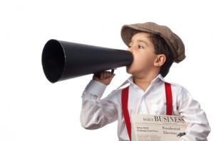 iStock_000017120534XSmall little boy with megaphone and newspaper