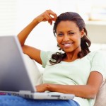 woman scheduling blog posts on her laptop