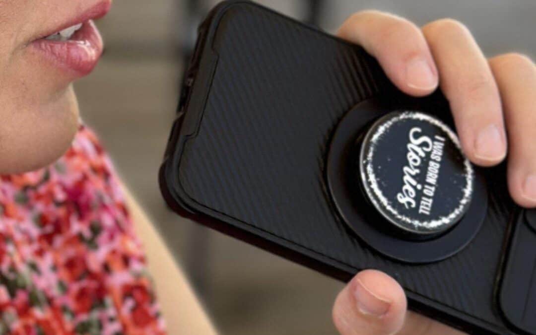 author dictating story into smartphone